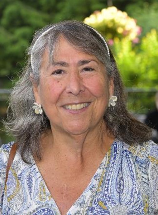 This image shows a headshot photo of philanthropist Debra Hollander smiling.