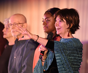 Director Teya Sepinuck and cast members Brienne Bush, Norm Wisler, and Nora Dougherty, on stage