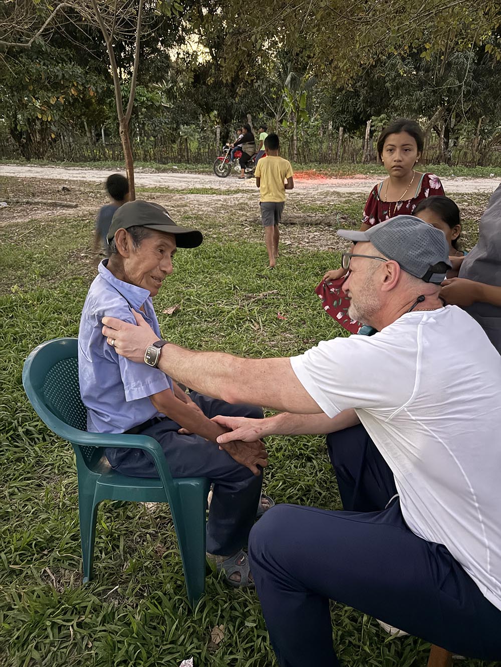 This image shows James Gardner III, MD ’02, with a patient on a medical mission trip in Guatemala.