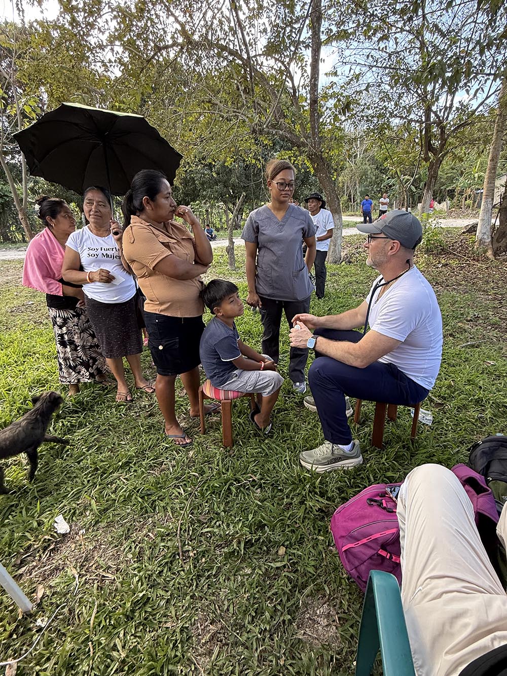 This image shows James Gardner III, MD ’02, with a group of people on a medical mission trip in Guatemala.