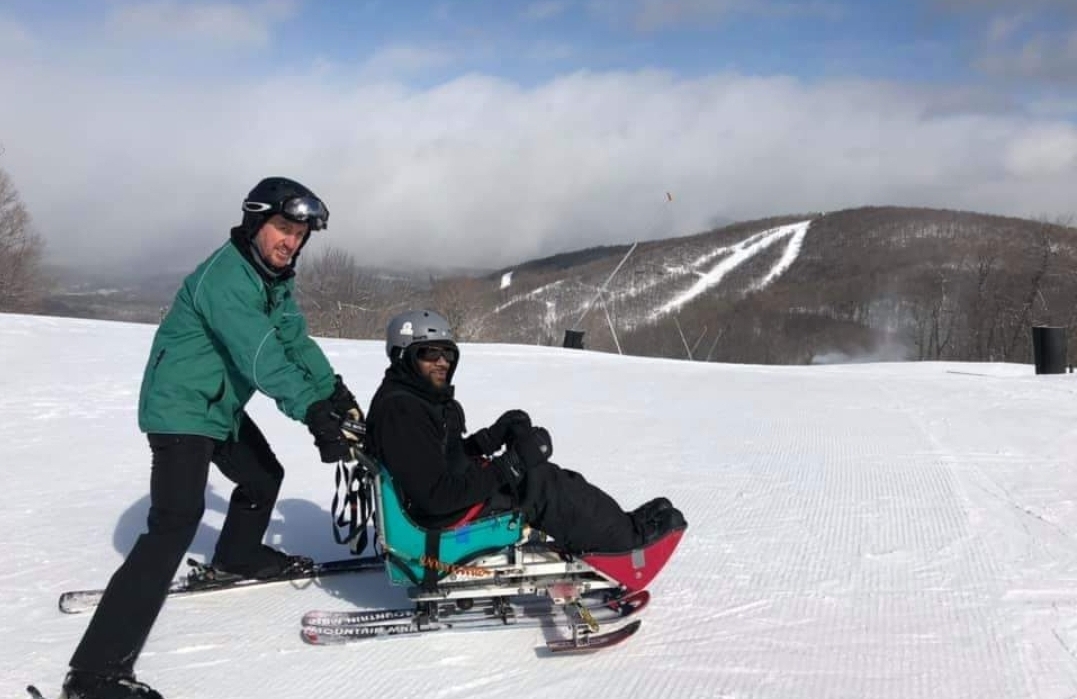 This image shows Jefferson Moss-Magee Rehabilitation patient Delano Turnipseed in an adaptive sitting ski.