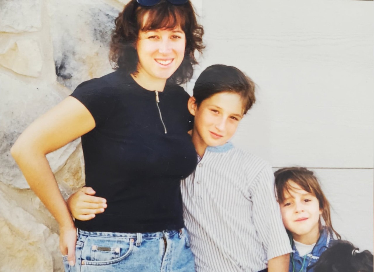 This image shows a photo of Karen Holloway, her son David, and her daughter Katie.